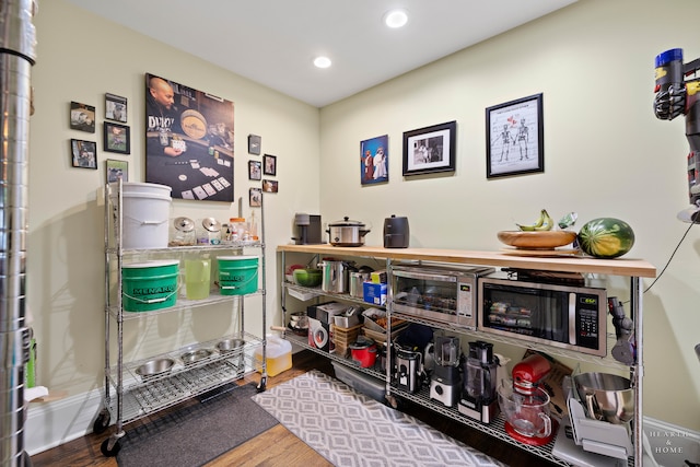 miscellaneous room with hardwood / wood-style floors