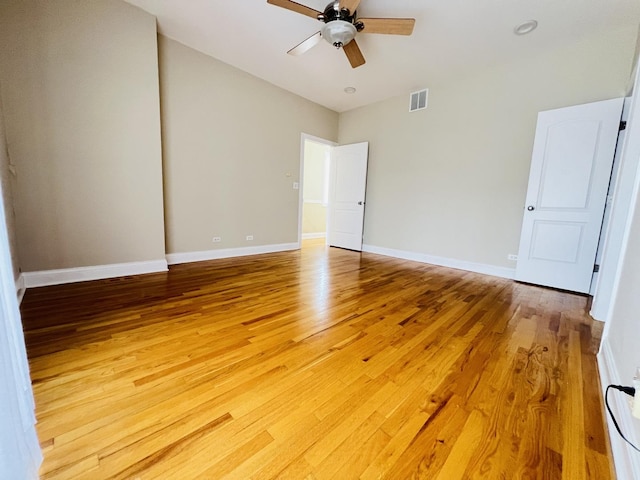 empty room featuring wood-type flooring and ceiling fan