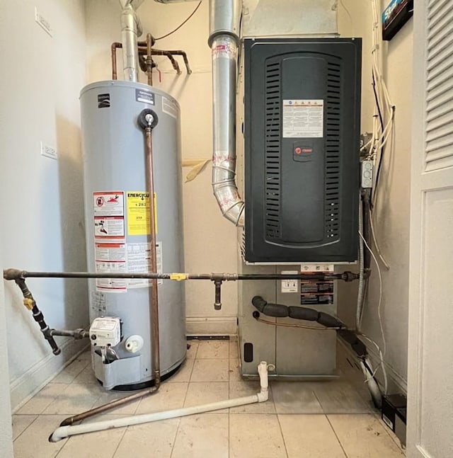 utility room with gas water heater