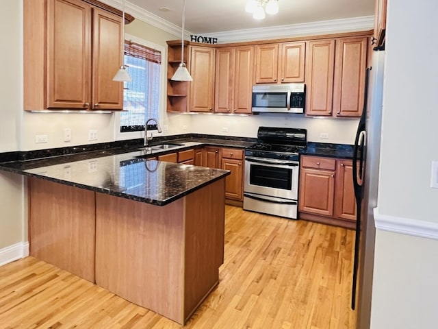 kitchen with stainless steel appliances, kitchen peninsula, dark stone countertops, decorative light fixtures, and ornamental molding