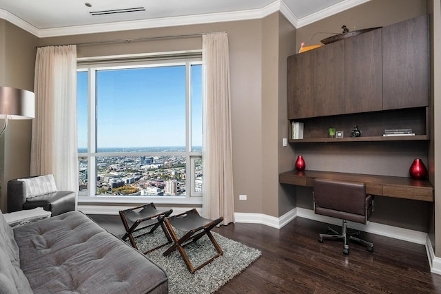 home office with built in desk, dark hardwood / wood-style flooring, and ornamental molding