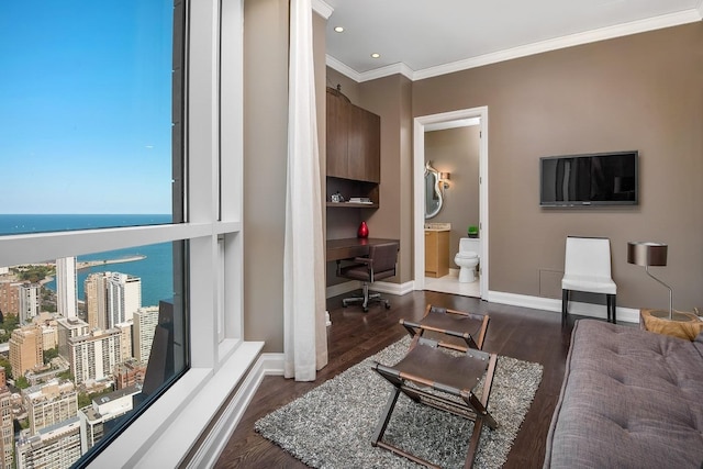 living room featuring ornamental molding, a water view, and dark hardwood / wood-style floors