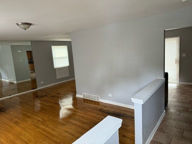 unfurnished room featuring hardwood / wood-style floors