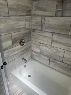 bathroom with shower / bathtub combination