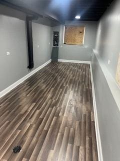 basement featuring dark hardwood / wood-style floors