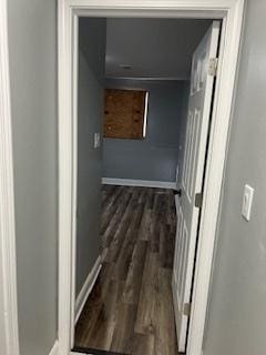 corridor featuring dark hardwood / wood-style flooring