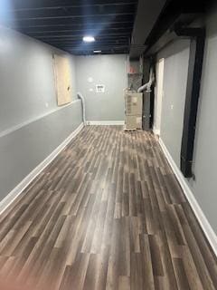 basement featuring dark hardwood / wood-style flooring