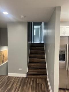 stairway featuring hardwood / wood-style floors