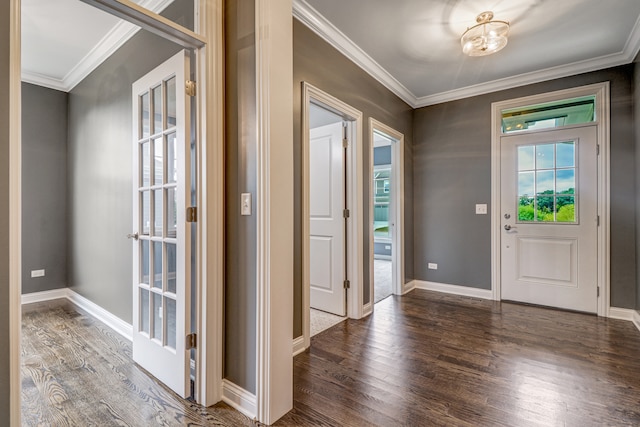 entryway with ornamental molding and dark hardwood / wood-style flooring