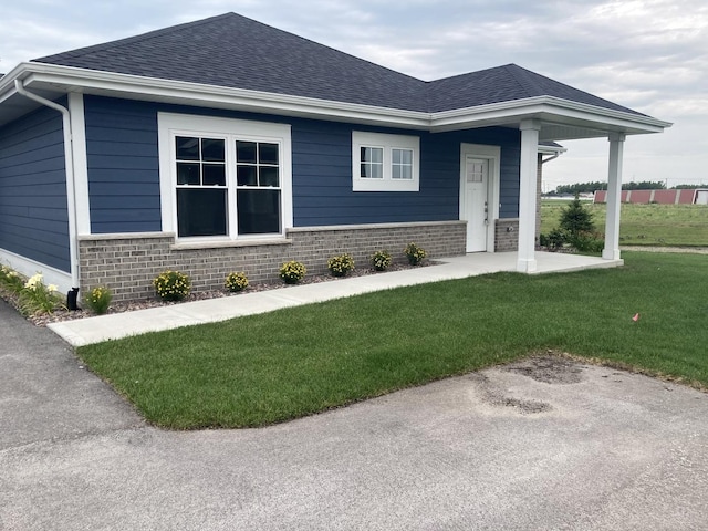 view of front of home with a front yard