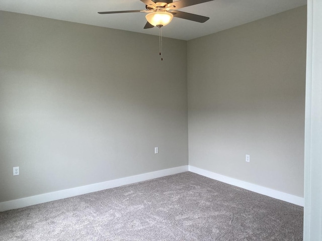 unfurnished room featuring carpet flooring and ceiling fan