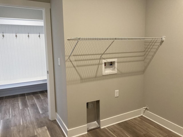 washroom with washer hookup and hardwood / wood-style flooring