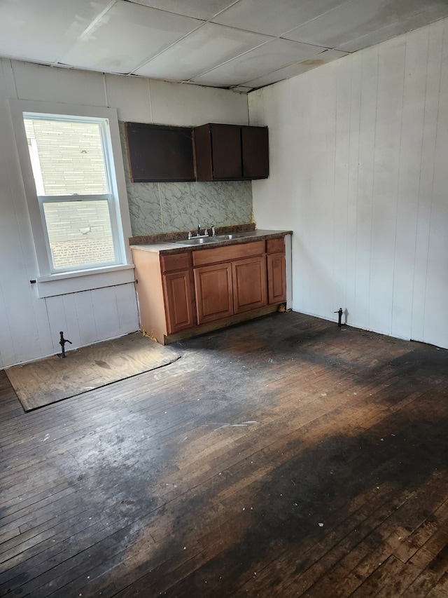 kitchen with sink and dark wood-type flooring