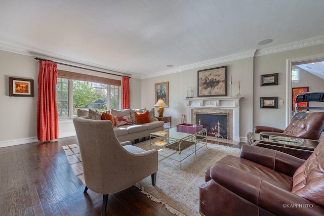 living room with wood-type flooring, a premium fireplace, and crown molding