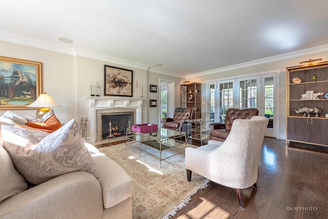 living room featuring hardwood / wood-style flooring, ornamental molding, and french doors