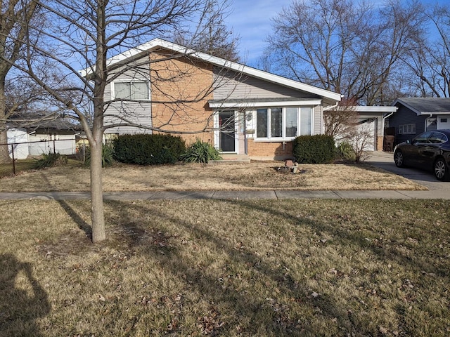 view of front facade with a front yard and a garage