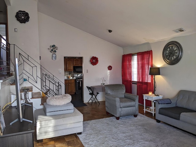 living room featuring dark parquet flooring and lofted ceiling