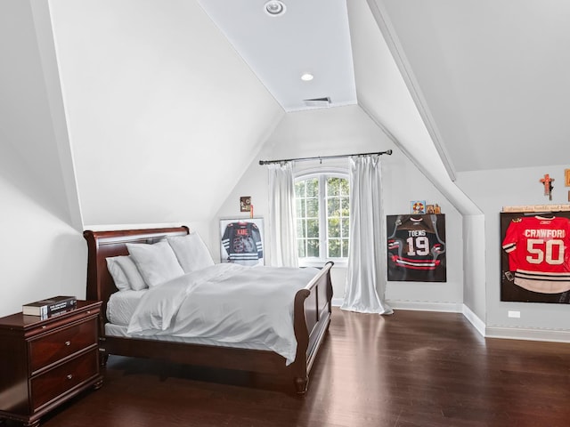 bedroom with vaulted ceiling, recessed lighting, wood finished floors, and baseboards