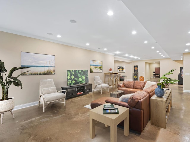 living room featuring recessed lighting, concrete floors, and baseboards