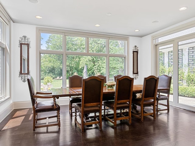 dining space with baseboards, dark wood finished floors, and recessed lighting