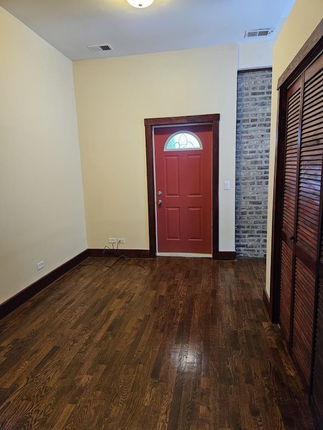 entrance foyer with dark hardwood / wood-style floors