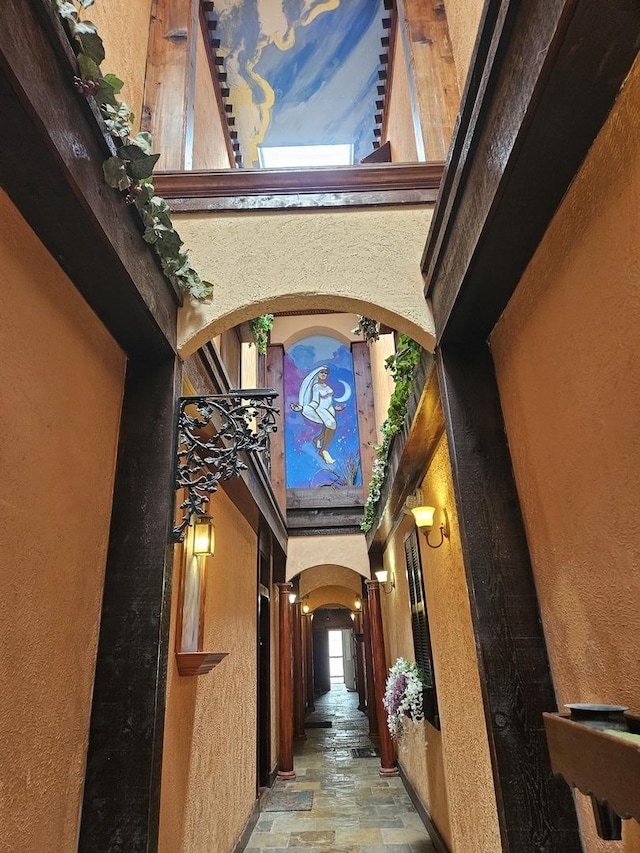 hallway with a towering ceiling