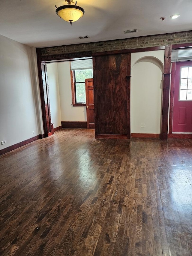 unfurnished room with hardwood / wood-style floors