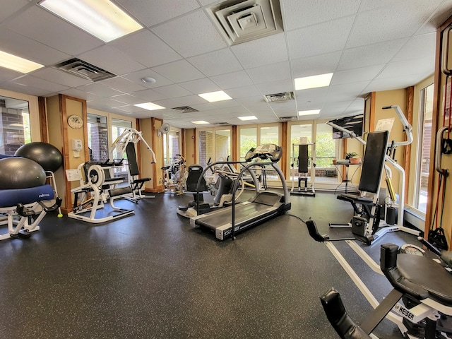 workout area with a drop ceiling