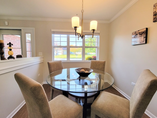 dining room featuring crown molding, a chandelier, and hardwood / wood-style floors