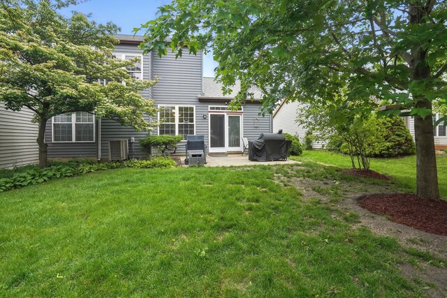 1406 Trescott St, Mundelein, IL 60060 - back of house featuring a patio area and a yard