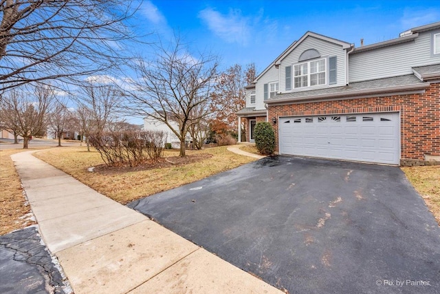 view of side of property with a garage