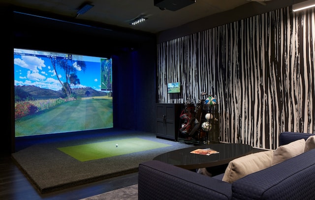 playroom featuring golf simulator and dark wood-type flooring