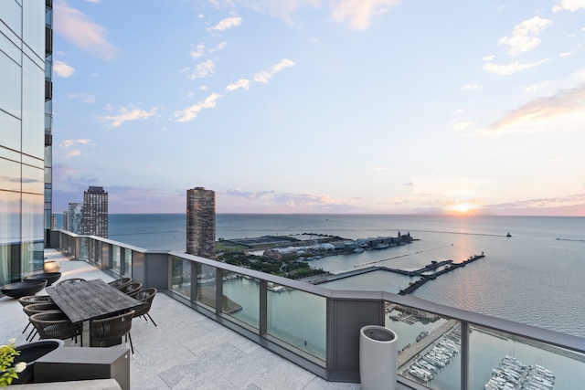 balcony at dusk with a water view