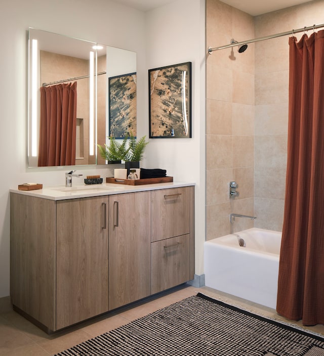 bathroom featuring tile patterned floors, shower / bathtub combination with curtain, and vanity