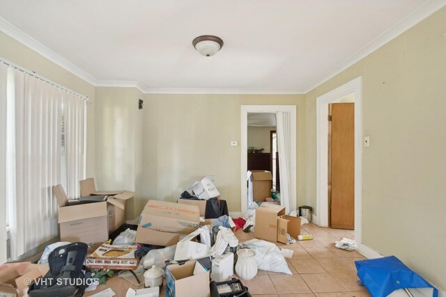 living room featuring ornamental molding and light tile patterned floors