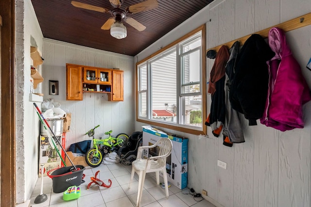 interior space featuring wood ceiling and ceiling fan