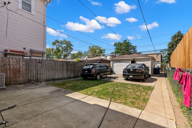 exterior space with a garage and an outbuilding