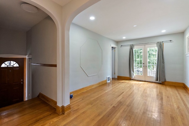 interior space with french doors and light wood-type flooring