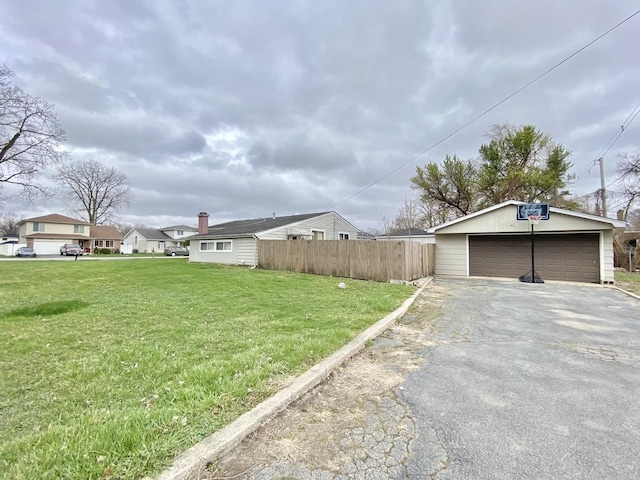 16404 Homan Ave, Markham, IL 60428 - view of yard with an outbuilding, a garage, and fence