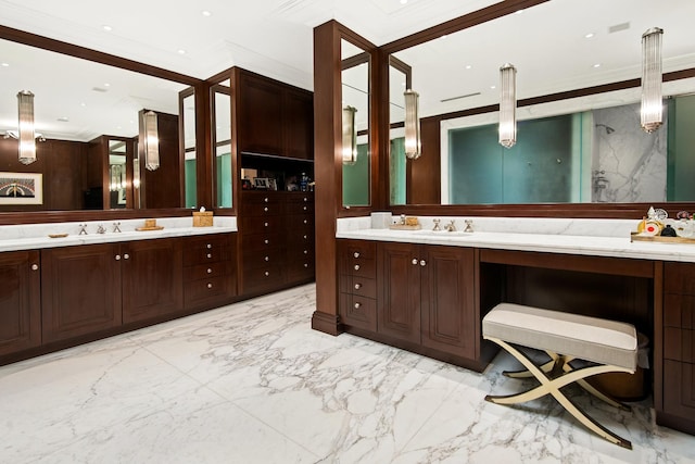 bathroom with ornamental molding and vanity