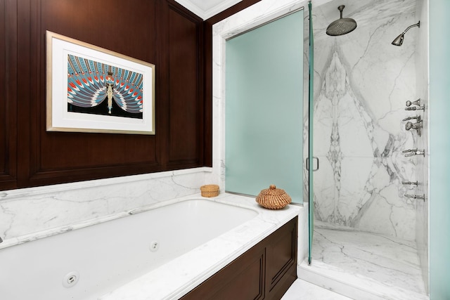 bathroom with crown molding and shower with separate bathtub