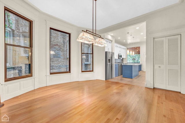 unfurnished dining area featuring light tile patterned flooring