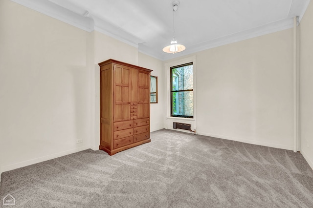 unfurnished bedroom featuring carpet flooring and crown molding