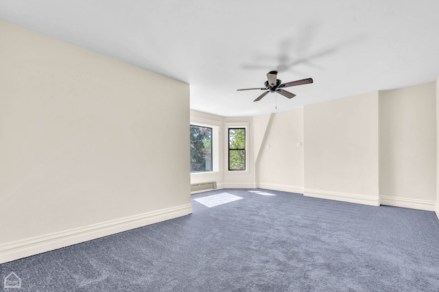 unfurnished room featuring carpet floors, ceiling fan, and baseboard heating