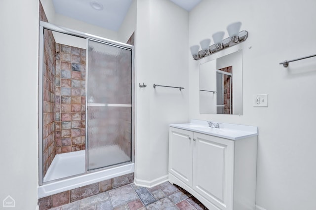 bathroom with vanity, walk in shower, and tile patterned floors