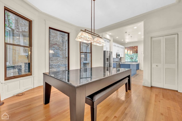 dining room with light hardwood / wood-style floors