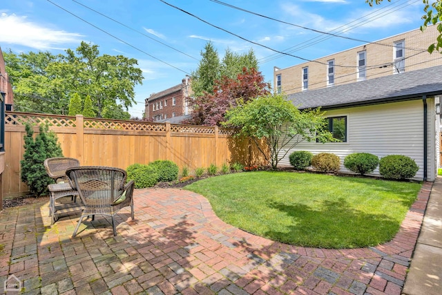 view of yard featuring a patio and fence