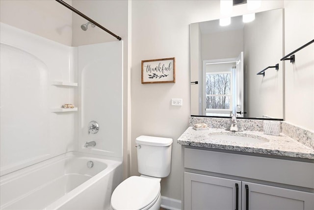 full bath with bathtub / shower combination, vanity, and toilet