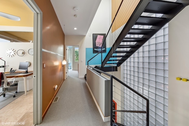 hallway featuring carpet floors