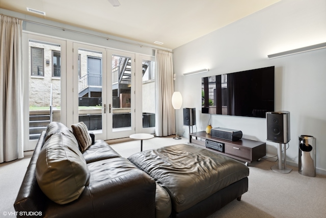 carpeted living room featuring french doors